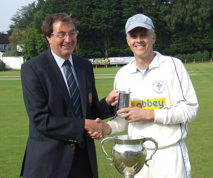 Simon Thompson receives the Man of the Match award from NCU President Chris Harte